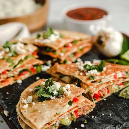 These vegetarian quesadillas are super quick and easy to make. Use whatever vegetables and cheese you have on hand for a delicious, (relatively) healthy meal.