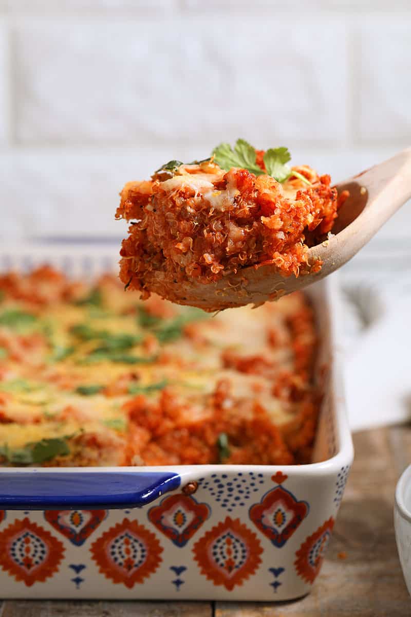 This quinoa pizza casserole is the perfect healthy side dish if you love pizza!  With all the flavors you love, plus topped with cheese (and your other favorite pizza toppings) everyone will love this! Gluten-free with a vegan option.