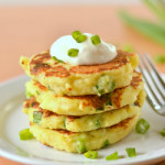 image of a stack of mashed potato pancakes topped with sour cream and chives