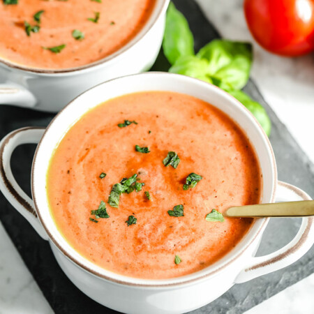 This simple tomato soup recipe will become your go-to for a fast and delicious meal. With fresh or canned tomatoes, this soup can be on the table in less than 30 minutes and the flavor is incredible! You'll never go back to canned stuff after you try this easy homemade tomato soup. With paleo and vegan options.
