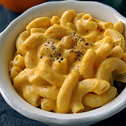 photo of a bowl full of creamy pumpkin mac and cheese