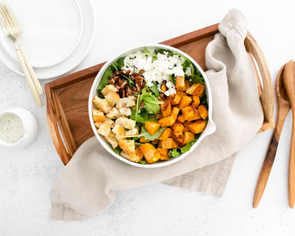 sweet potato goat cheese salad in bowl with napkin