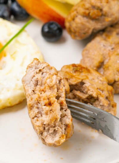 sausage patties on plate with a fork
