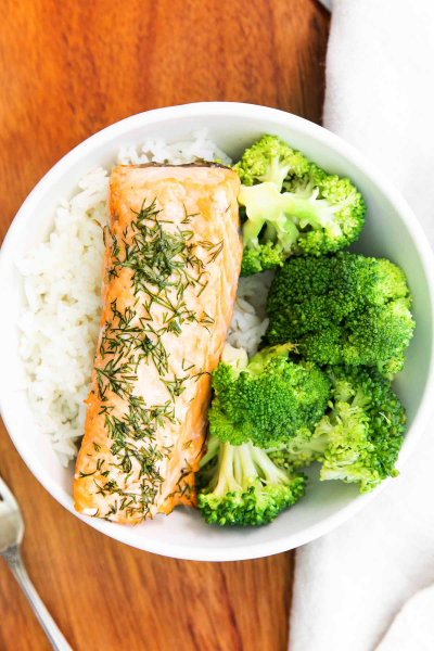overhead shot of air fryer salmon with broccoli