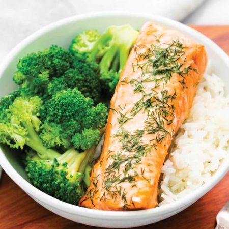 Salmon broccoli and rice in bowl.