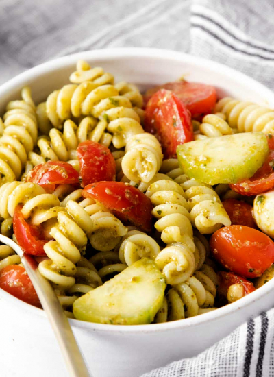closeup of bowl of summer pesto pasta salad