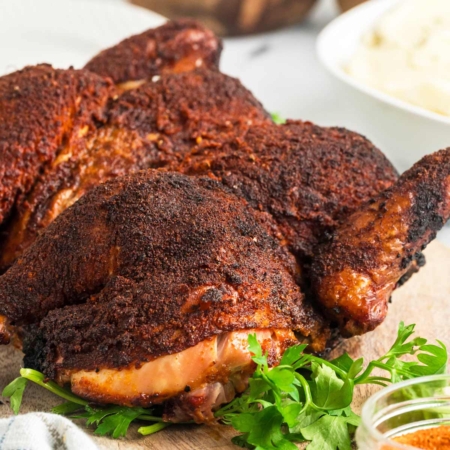 photo showing a spice encrusted smoked spatchcock chicken