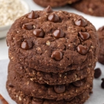 close-up of a stack of cocoa oatmeal cookies on a white table