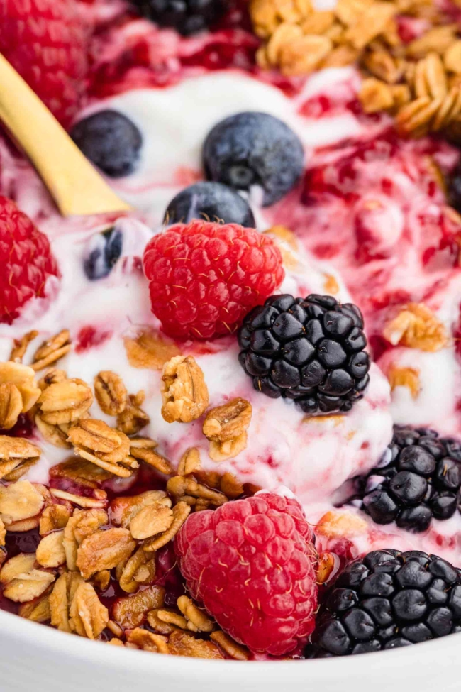 close-up of granola bowls with yogurt and berries 