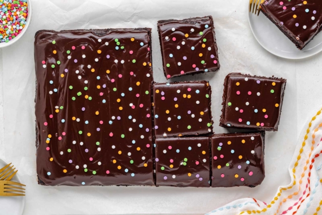 full pan of brownies with ganache and sprinkles on top