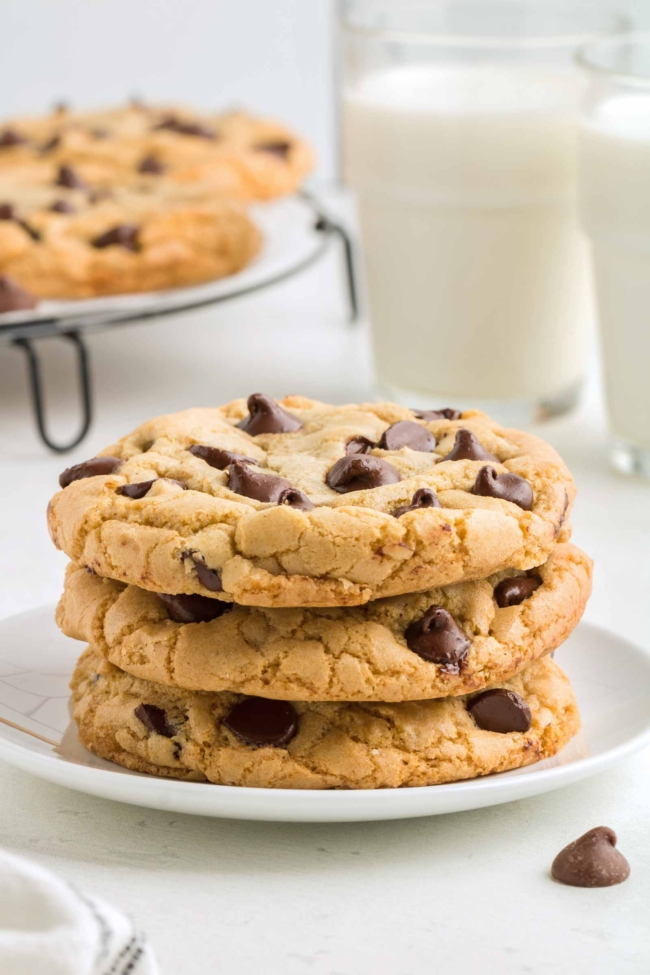 Photo of a stack of three chocolate chip cookies made with oil instead of butter.
