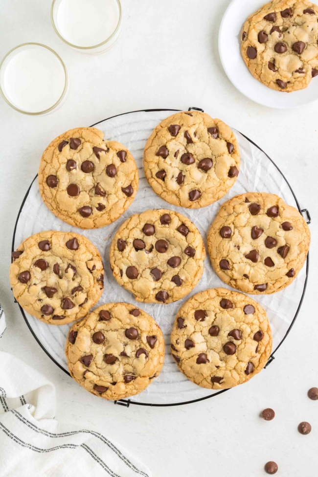 Overhead photo of a plate full of chocolate chip cookies made without butter and loaded with chocolate chips.