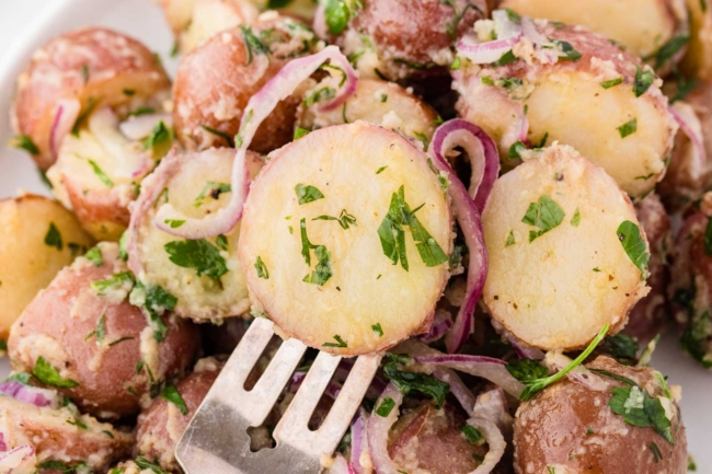 close-up of a fork poking a potato