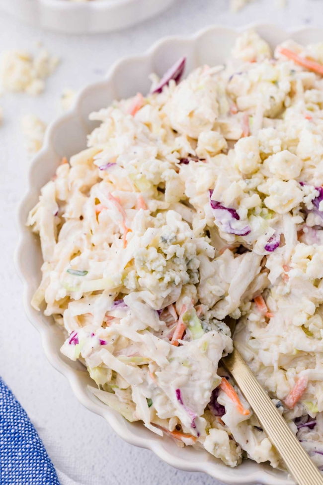 close up of blue cheese slaw in a white bowl