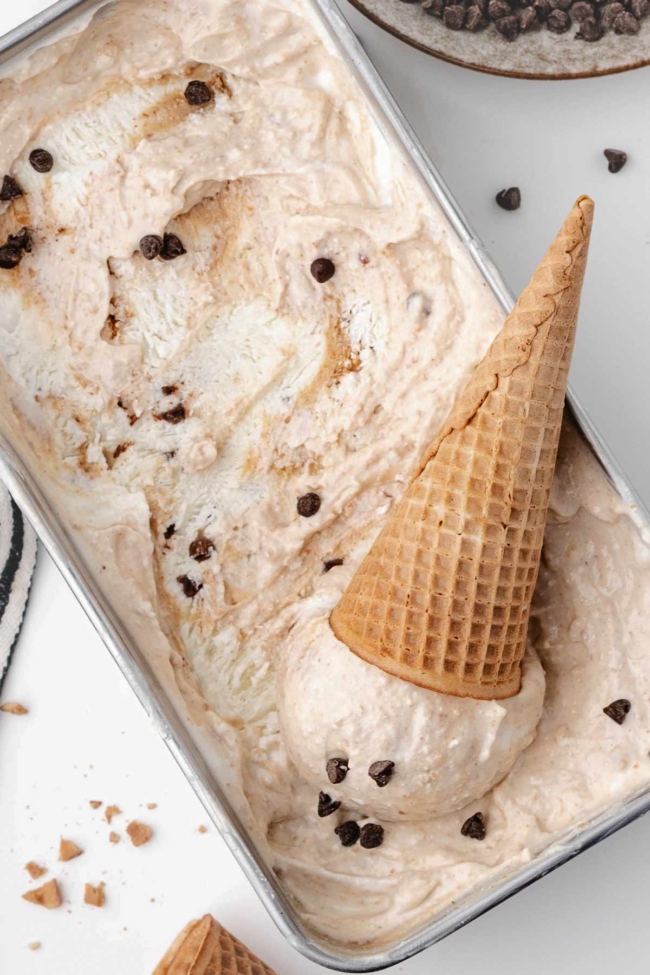 loaf pan filled with cottage cheese ice cream along with an ice cream cone