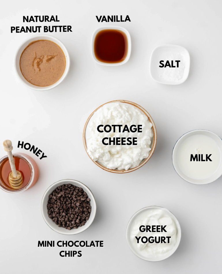 all ingredients laid out on a white table to make cottage cheese ice cream