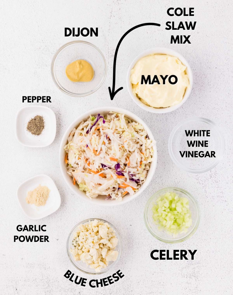 ingredients needed to make blue cheese slaw on a white table