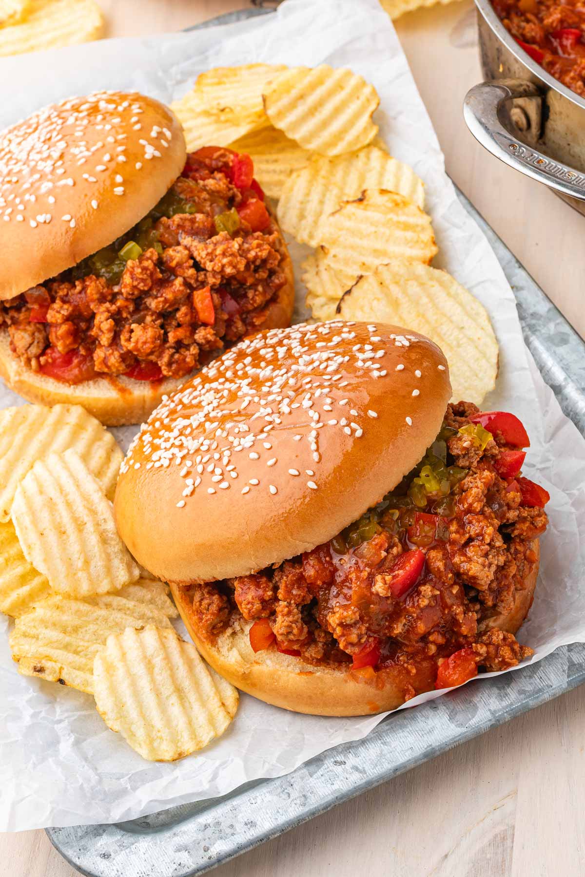 ground turkey sloppy joes served in a tray with chips