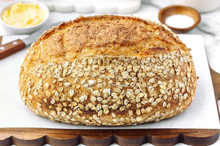 side shot of the full baked honey oat sourdough bread