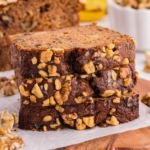 wheat banana nut bread slices on parchment paper