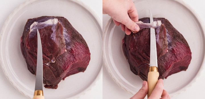 Slicing a raw venison roast to prepare for making venison jerky.