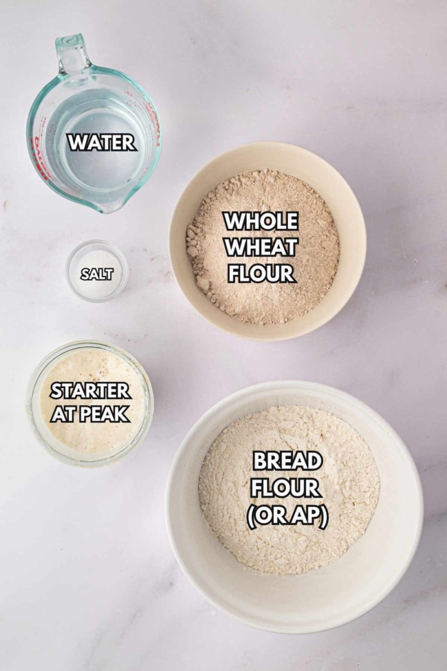 Ingredients for whole wheat sourdough: whole wheat flour, bread flour, water, salt, and active starter.